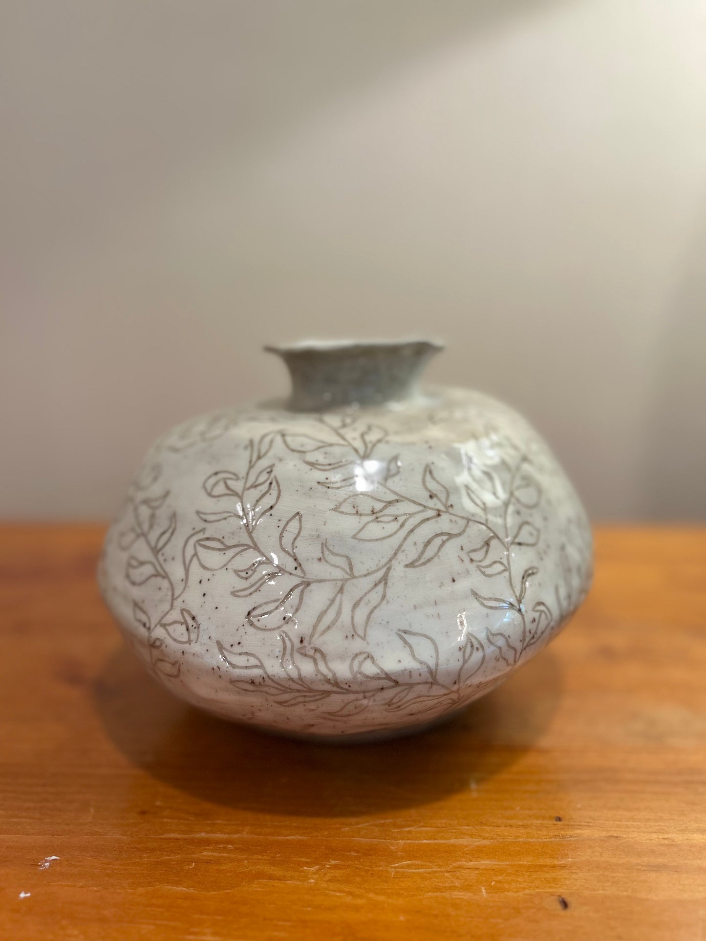 Ceramic vase with leaf patterns